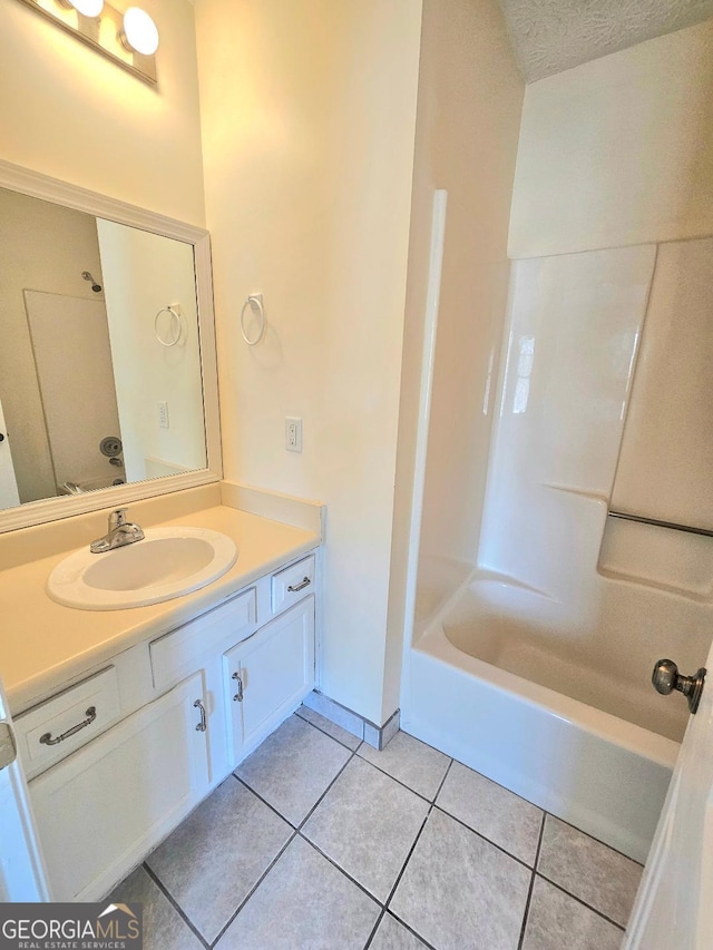 1557 Springleaf Ct SE, Smyrna, GA 30080 - bathroom featuring tile patterned floors, washtub / shower combination, and vanity