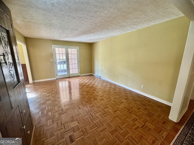 839 Golf Dr, Swainsboro, GA 30401 - empty room featuring baseboards and a textured ceiling