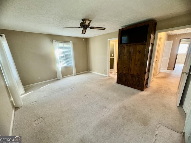 839 Golf Dr, Swainsboro, GA 30401 - unfurnished bedroom with baseboards, carpet, and a textured ceiling