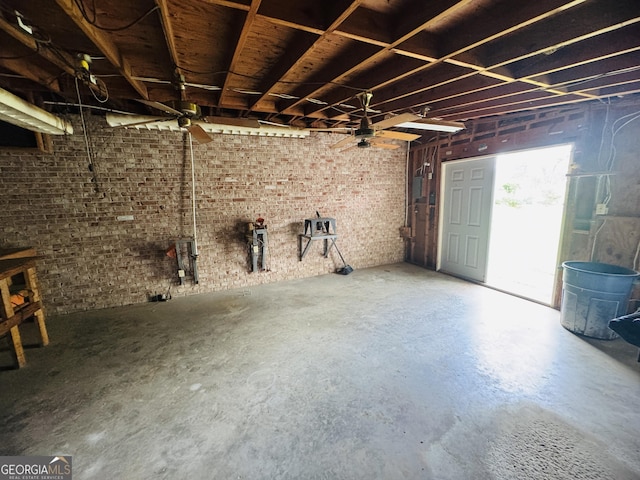 839 Golf Dr, Swainsboro, GA 30401 - miscellaneous room with ceiling fan, concrete floors, and brick wall