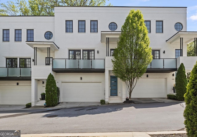 1337 Grey Fox Ct NE Unit 7, Atlanta, GA 30306 - multi unit property with a balcony, brick siding, and an attached garage