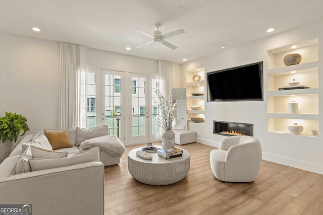 1337 Grey Fox Ct NE Unit 7, Atlanta, GA 30306 - living room with baseboards, ceiling fan, built in features, and wood finished floors