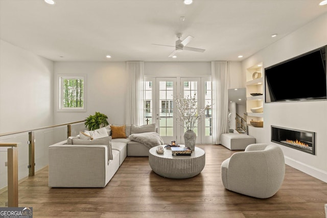 1337 Grey Fox Ct NE Unit 7, Atlanta, GA 30306 - living area with wood finished floors, a ceiling fan, a glass covered fireplace, and recessed lighting