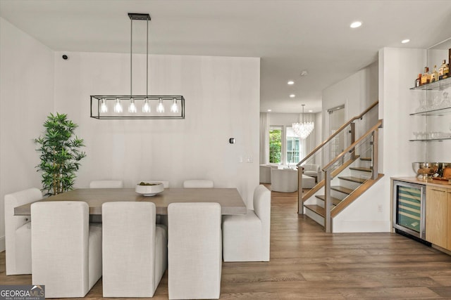1337 Grey Fox Ct NE Unit 7, Atlanta, GA 30306 - dining room with wood finished floors, stairway, beverage cooler, a bar, and a notable chandelier