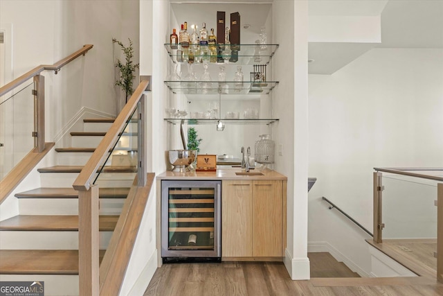 1337 Grey Fox Ct NE Unit 7, Atlanta, GA 30306 - bar featuring light wood finished floors, a sink, baseboards, wet bar, and wine cooler