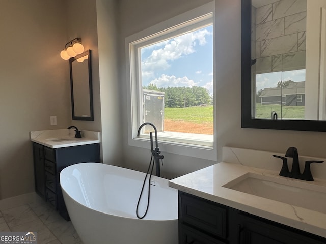 1502 Whooping Creek Church Rd, Carrollton, GA 30117 - full bath with a freestanding bath, two vanities, a sink, and marble finish floor