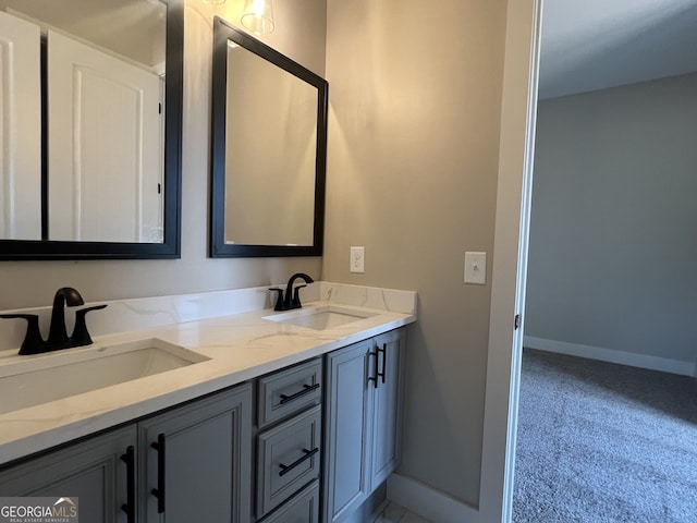 1502 Whooping Creek Church Rd, Carrollton, GA 30117 - bathroom featuring a sink, baseboards, and double vanity