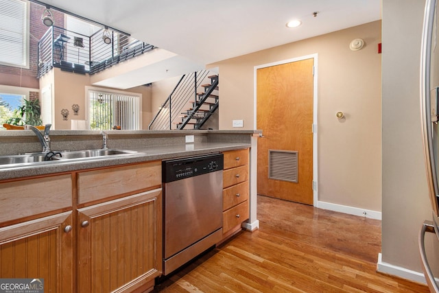 1133 Church Unit 1, Covington, GA 30014 - kitchen with dishwasher, a sink, light wood-style floors, baseboards, and recessed lighting
