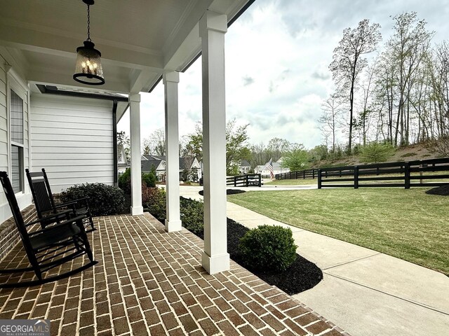 305 Red Gate Ln, Canton, GA 30115 - view of patio featuring covered porch and fence