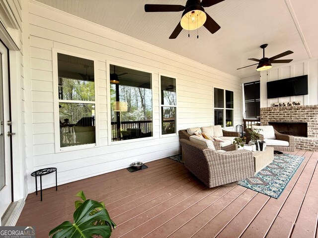305 Red Gate Ln, Canton, GA 30115 - deck featuring ceiling fan and an outdoor living space with a fireplace