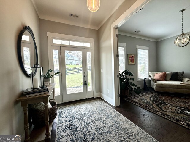 305 Red Gate Ln, Canton, GA 30115 - entryway with ornamental molding, visible vents, baseboards, and dark wood finished floors
