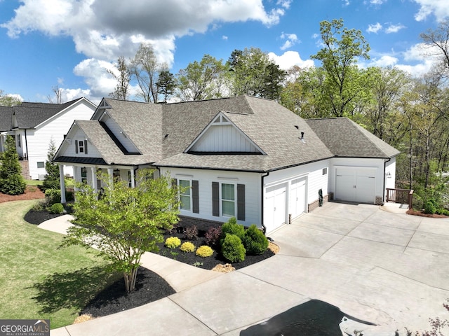 305 Red Gate Ln, Canton, GA 30115 - view of front facade with concrete driveway, roof with shingles, a front yard, brick siding, and a garage