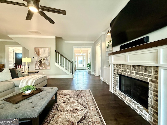 305 Red Gate Ln, Canton, GA 30115 - living area featuring baseboards, ornamental molding, stairway, a brick fireplace, and ceiling fan