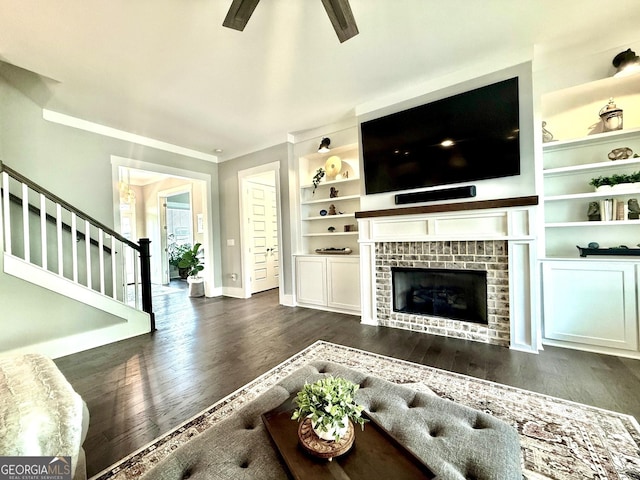 305 Red Gate Ln, Canton, GA 30115 - living room with a fireplace, a ceiling fan, stairway, dark wood-style flooring, and baseboards