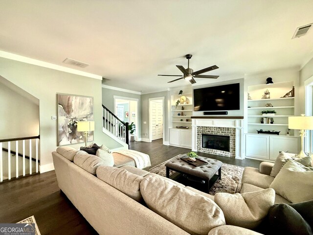 305 Red Gate Ln, Canton, GA 30115 - living area with visible vents, ceiling fan, a fireplace, and dark wood finished floors