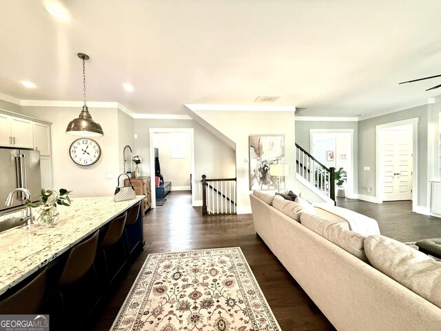 305 Red Gate Ln, Canton, GA 30115 - living area featuring ornamental molding, visible vents, recessed lighting, dark wood-style flooring, and baseboards