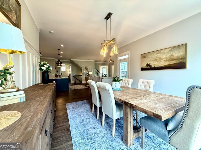 305 Red Gate Ln, Canton, GA 30115 - dining area with dark wood-style flooring, a chandelier, recessed lighting, crown molding, and stairs