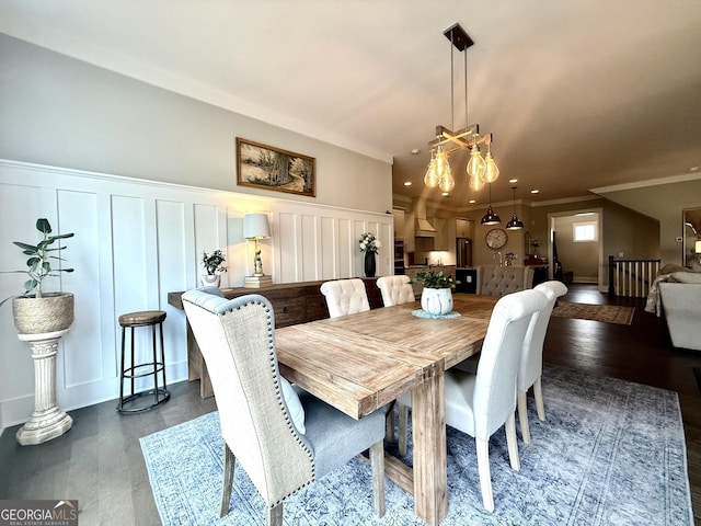 305 Red Gate Ln, Canton, GA 30115 - dining area with crown molding, a decorative wall, dark wood-type flooring, recessed lighting, and a wainscoted wall