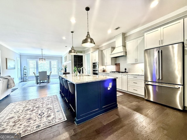 305 Red Gate Ln, Canton, GA 30115 - kitchen featuring visible vents, a sink, ornamental molding, appliances with stainless steel finishes, and premium range hood
