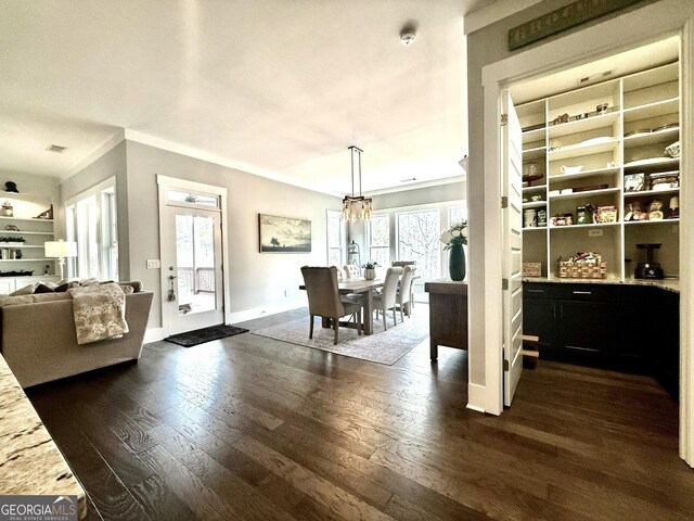 305 Red Gate Ln, Canton, GA 30115 - dining space with dark wood-style flooring, baseboards, ornamental molding, a chandelier, and visible vents