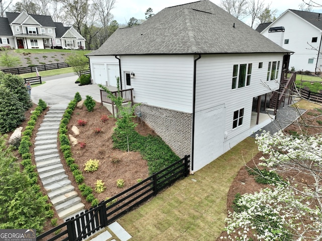 305 Red Gate Ln, Canton, GA 30115 - view of side of property with roof with shingles, a lawn, fence, and stairway