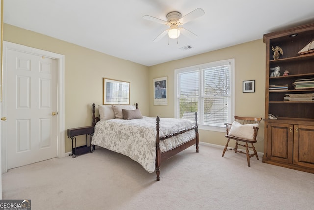bedroom with ceiling fan, baseboards, light colored carpet, and visible vents