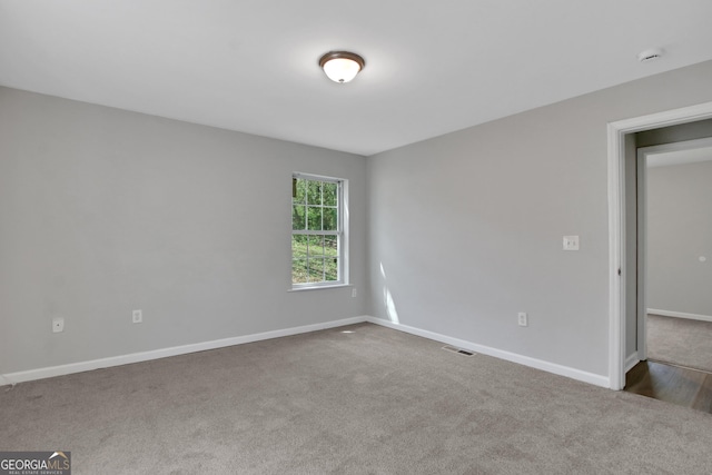 944 Joseph E Boone Blvd NW, Atlanta, GA 30314 - unfurnished room with baseboards, visible vents, and carpet floors
