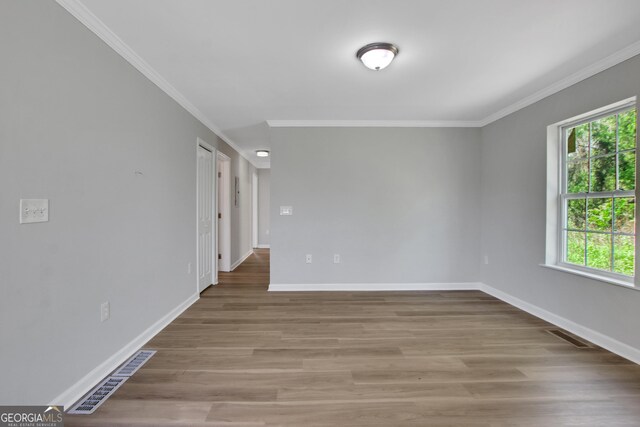 944 Joseph E Boone Blvd NW, Atlanta, GA 30314 - empty room featuring plenty of natural light, visible vents, baseboards, and crown molding