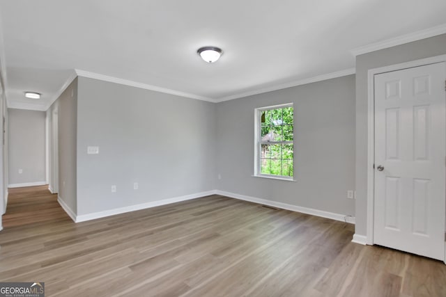 944 Joseph E Boone Blvd NW, Atlanta, GA 30314 - unfurnished bedroom with baseboards, crown molding, and wood finished floors