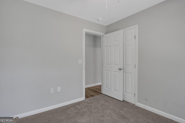 944 Joseph E Boone Blvd NW, Atlanta, GA 30314 - unfurnished bedroom with carpet flooring and baseboards