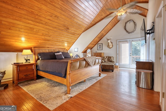 bedroom featuring hardwood / wood-style floors, wood ceiling, lofted ceiling with beams, and access to outside