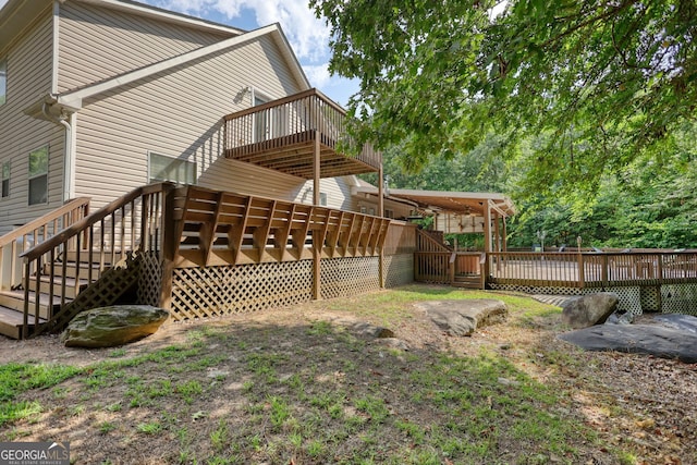 back of property featuring a wooden deck