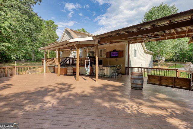 wooden terrace featuring outdoor dry bar