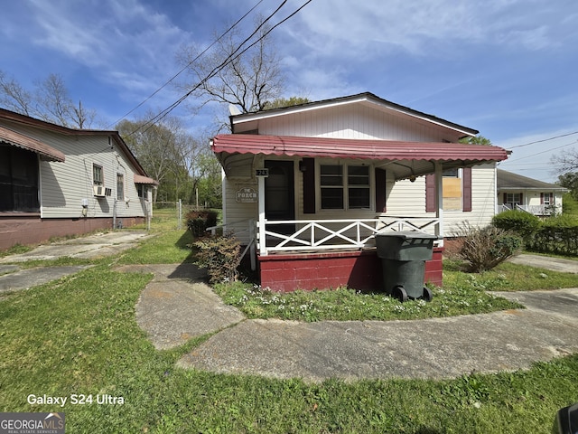 view of front facade featuring cooling unit and a porch