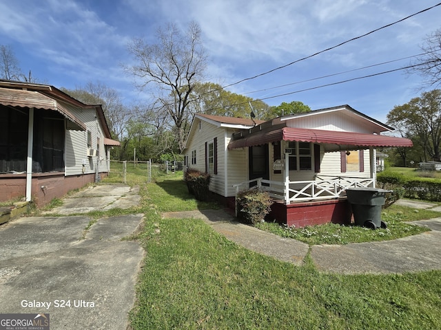 view of property exterior featuring driveway and a lawn
