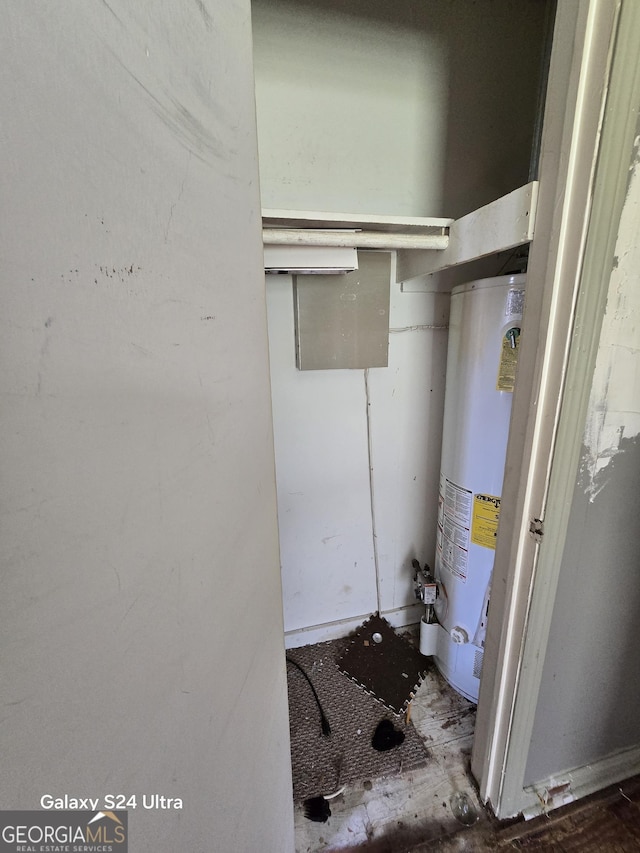 utility room featuring gas water heater