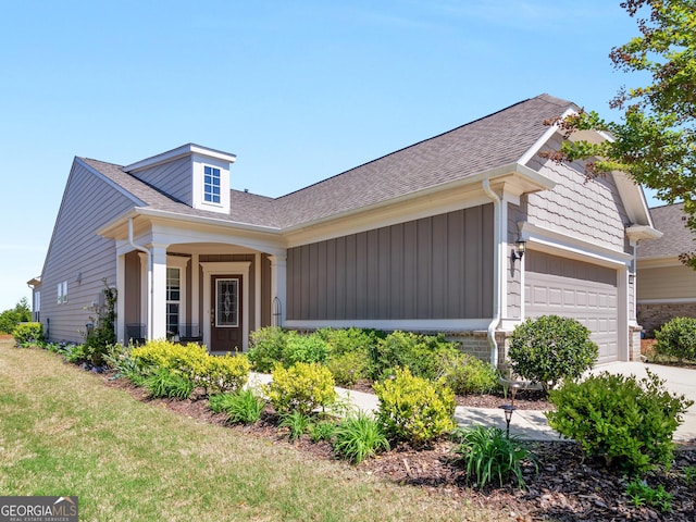 717 Bay Skipper Ct, Griffin, GA 30223 - view of front of property featuring roof with shingles, a garage, driveway, and board and batten siding
