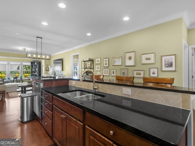 717 Bay Skipper Ct, Griffin, GA 30223 - kitchen featuring ornamental molding, open floor plan, dark wood-type flooring, recessed lighting, and stainless steel dishwasher