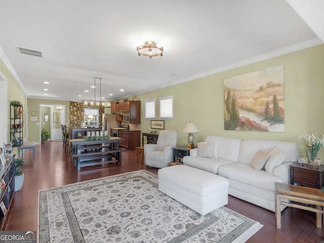 717 Bay Skipper Ct, Griffin, GA 30223 - living room featuring crown molding, dark wood-style floors, a chandelier, and recessed lighting