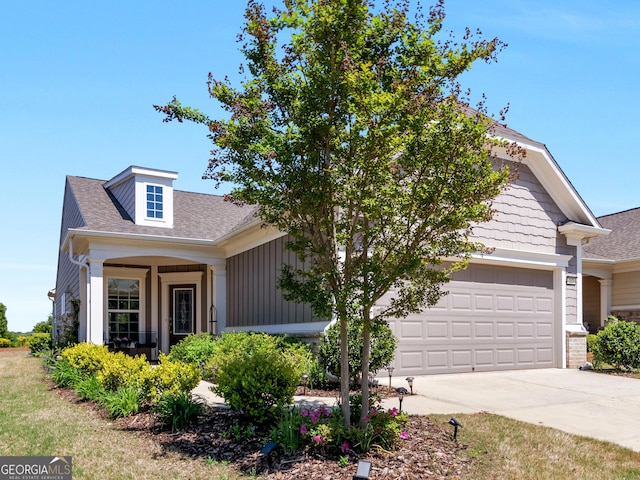717 Bay Skipper Ct, Griffin, GA 30223 - view of front of house with concrete driveway, roof with shingles, an attached garage, and board and batten siding