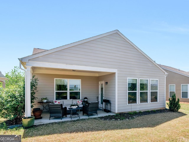 717 Bay Skipper Ct, Griffin, GA 30223 - rear view of property with an outdoor hangout area, a lawn, and a patio area