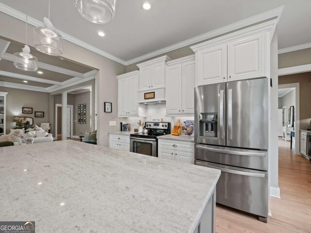 kitchen featuring range hood, open floor plan, appliances with stainless steel finishes, and white cabinetry