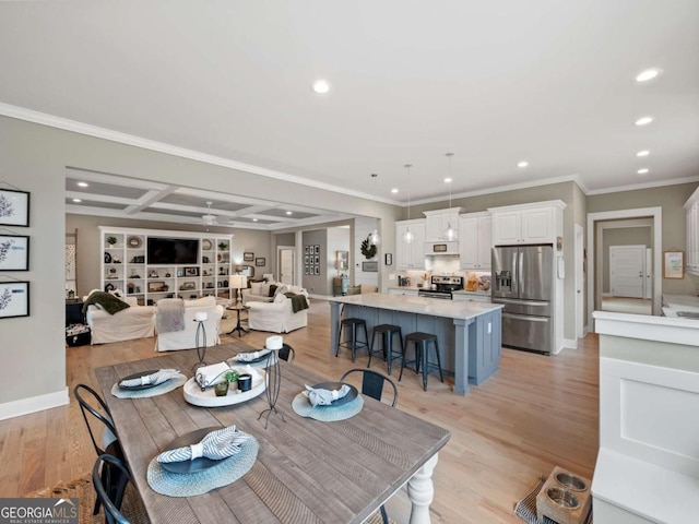 dining area featuring recessed lighting, ornamental molding, baseboards, and light wood-type flooring