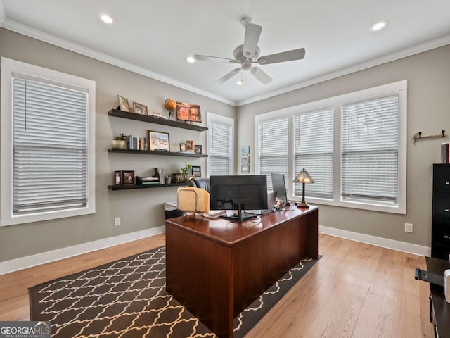 office area with baseboards, ceiling fan, wood finished floors, and ornamental molding