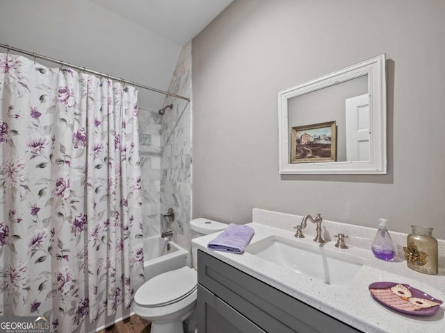 bathroom with toilet, shower / bath combination with curtain, and vanity