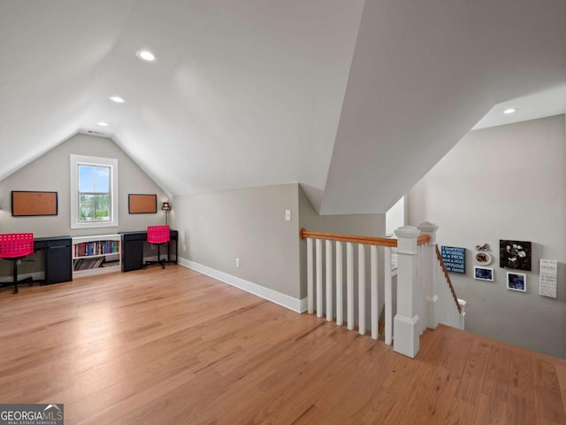 bonus room featuring baseboards, vaulted ceiling, recessed lighting, and light wood finished floors