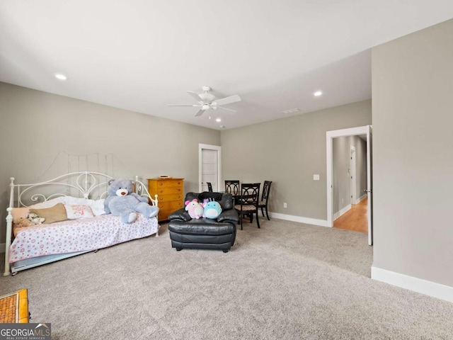 carpeted bedroom featuring baseboards, visible vents, recessed lighting, and a ceiling fan