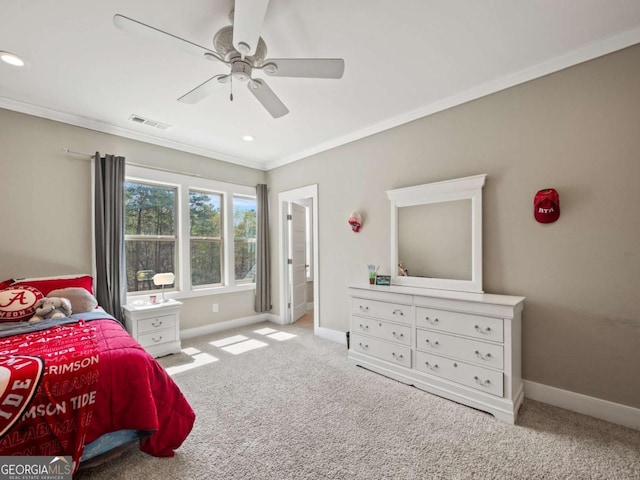 carpeted bedroom featuring baseboards, visible vents, ceiling fan, and ornamental molding
