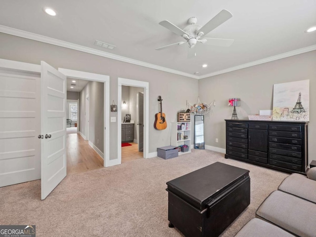 interior space with baseboards, ceiling fan, crown molding, and light carpet