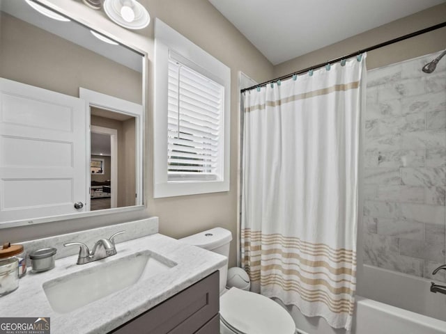 bathroom with toilet, shower / bath combo, and vanity